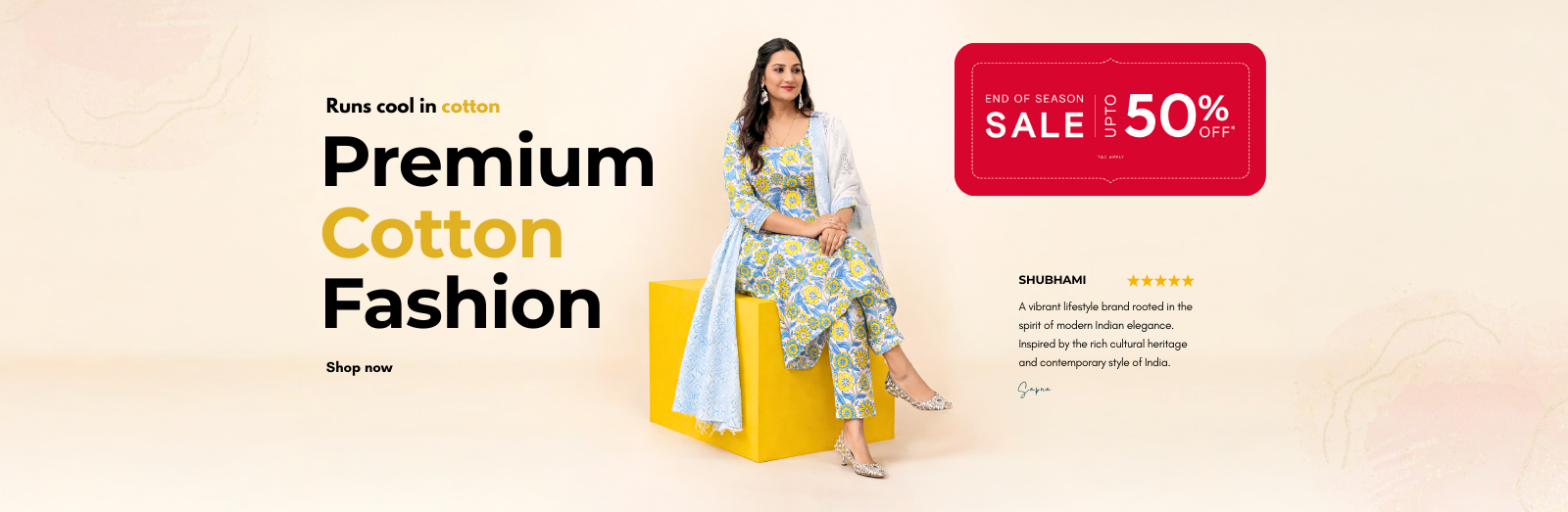Woman in a floral dress sitting on a yellow stool with promotional text for premium cotton fashion and a 50% sale.